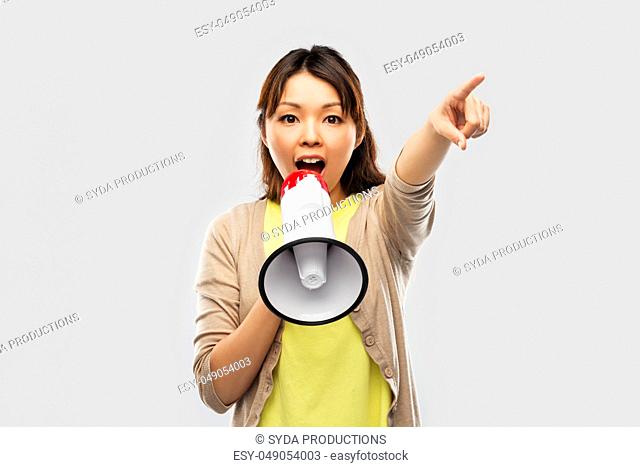asian woman speaking to megaphone