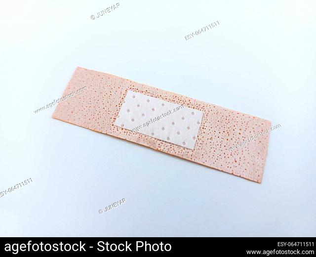 Small Size Adhesive Bandage Isolated On White Background. Tilted Inside View