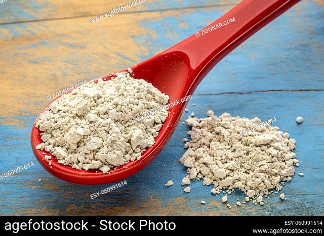 food grade diatomaceous earth supplement - stoneware teaspoon of powder