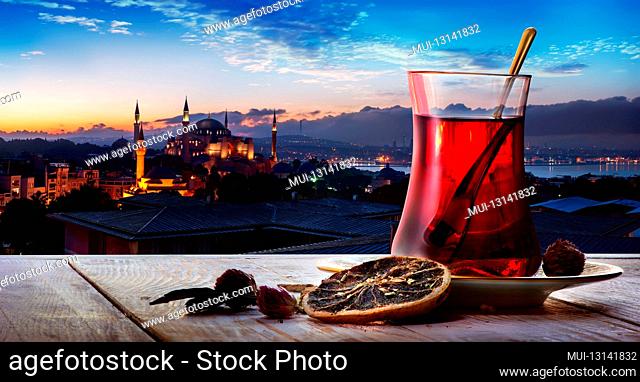 Turkish tea in the background of a mosque in Istanbul
