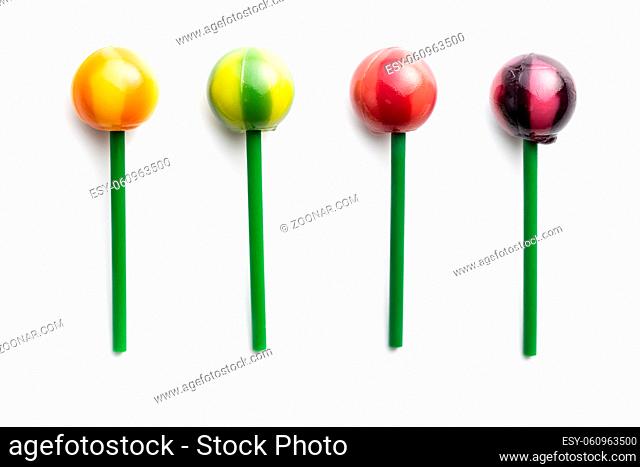 Sweet fruity lollipops isolated on white background