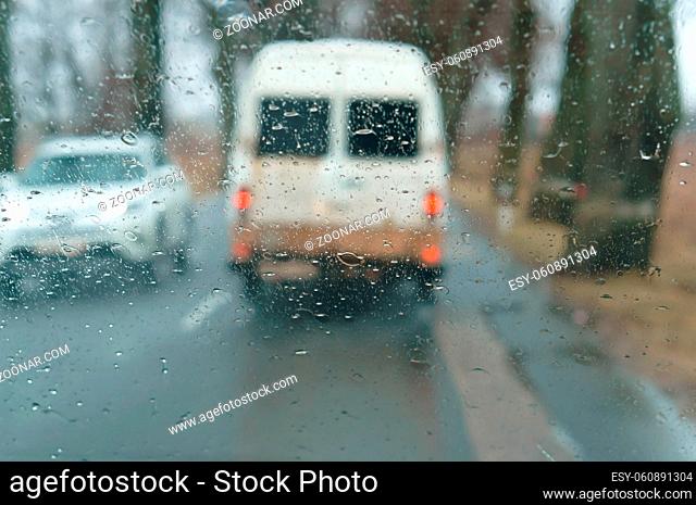 rain on glass, drive on highway in heavy rain, raindrops on car glass, wet asphalt