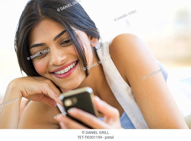 USA, New Jersey, Jersey City, Close-up view of young attractive woman text messaging