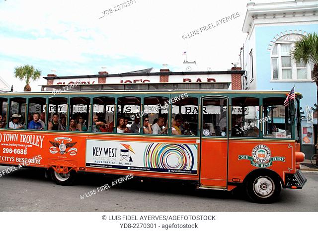 Tourists enjoying in a tourist bus from Duval Street in Key West, Florida, Key West is a city in Monroe County, Florida, United States