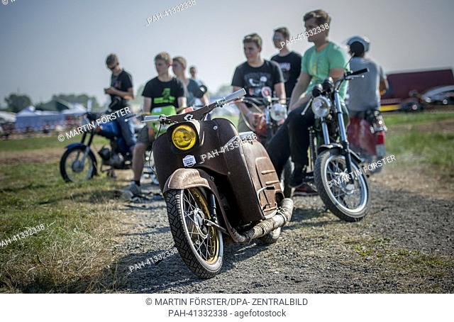 People attend the Simson meeting in Zwickau, Germany, 27 July 2013. Around 1, 500 East German cult motorcycles are expected at the meeting