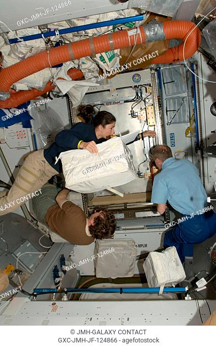 NASA astronauts Nicole Stott and Michael Barratt (bottom); along with European Space Agency astronaut Frank De Winne, all Expedition 20 flight engineers