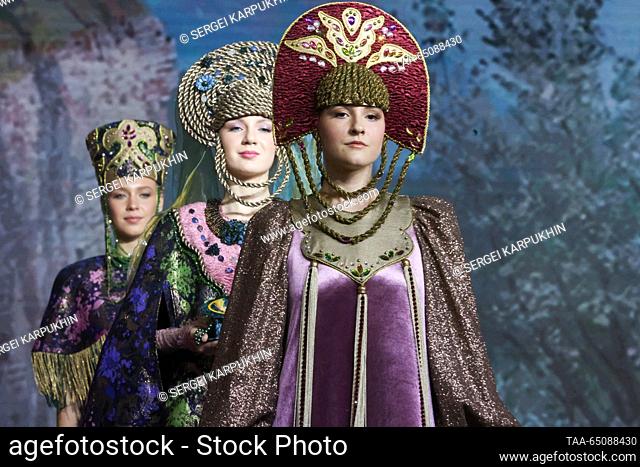 RUSSIA, MOSCOW - NOVEMBER 22, 2023: Models showcase costumes during a show of ethnic costumes inspired by the Ural tales and folk crafts