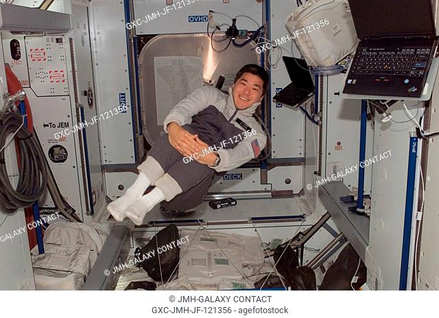 Astronaut Daniel Tani, Expedition 16 flight engineer, smiles for a photo while floating in the Harmony node of the International Space Station