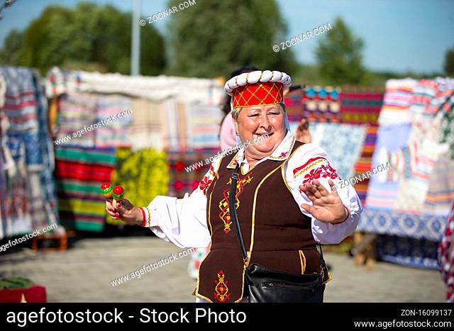 08/29/2020 Belarus, Lyaskovichi. A holiday in the city. A woman in Slavic national dress is dancing