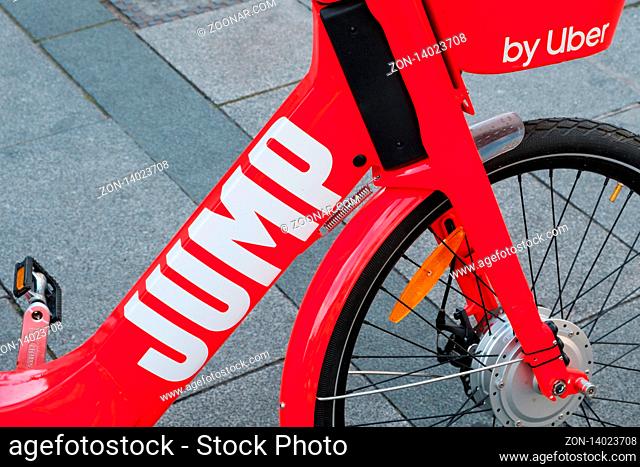 Berlin, Germany - June, 2019: Electric Bike sharing bicycle, JUMP by UBER on sidewalk in Berlin, Germany