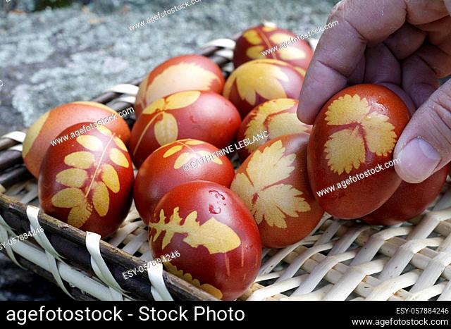 Take decorated Easter eggs in your hands. Saint-Gervais-les-Bains. Haute-Savoie. Auvergne Rhône-Alpes. France. Europe