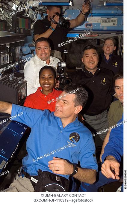 Expedition 16 and STS-120 crewmembers gather in the Destiny laboratory of the International Space Station shortly after Space Shuttle Discovery docked with the...