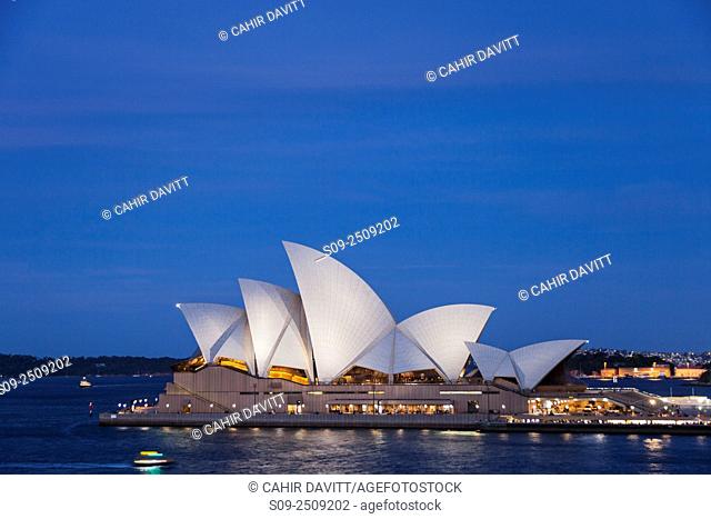 The sails of the Sydney Opera House, Designed by the Architect Jorn Utzorn at twilight, Bennelong Point, viewed from the Rocks, Sydney, New South Wales