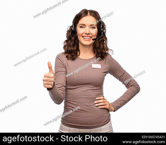 shop assistant with headset showing thumbs up