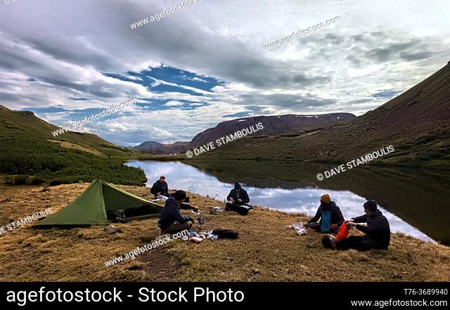 Thru hikers enjoying camp at Cataract Lake on the 485 mile Colorado Trail, near Lake City, Colorado