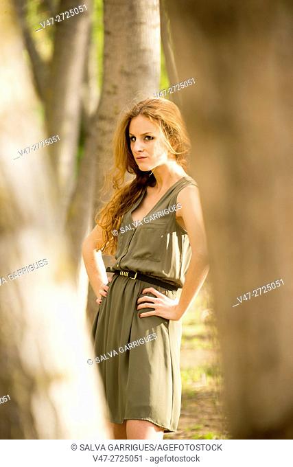 Young woman with a dress in the forest of poplars, Alboy, Genoves, Valencia, Spain, Europe