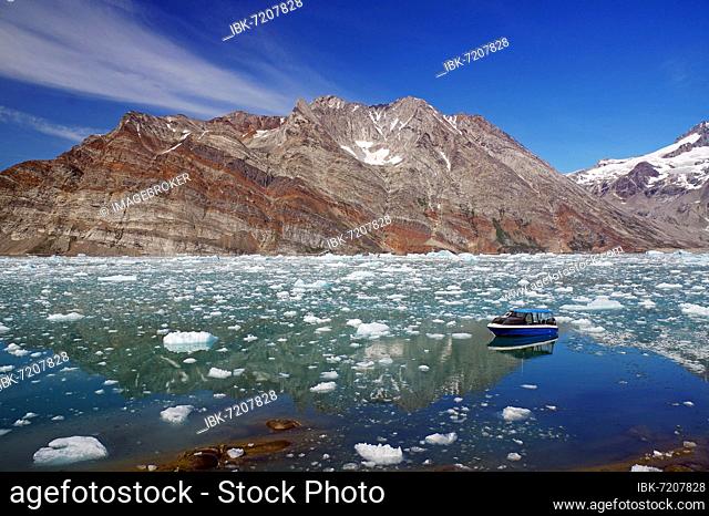 Small boat in a fjord with ice and icebergs, glacier, Arctic, Knud Rasmussen Fjord, East Greenland, Greenland, denmark, North America