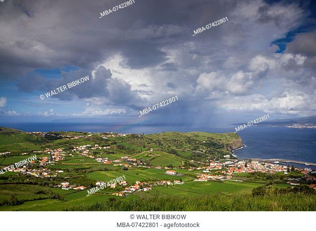 Portugal, Azores, Faial Island, Horta, elevated town view with rainbow towards Espalamaca from Monte Carneiro