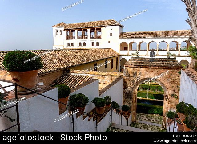 Granada, Spain - 5 February, 2021: view of the Generalife Palace and grounds in the Alhambra Palace complex above Granada