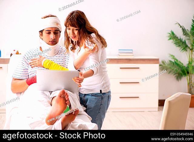 Loving wife looking after injured husband