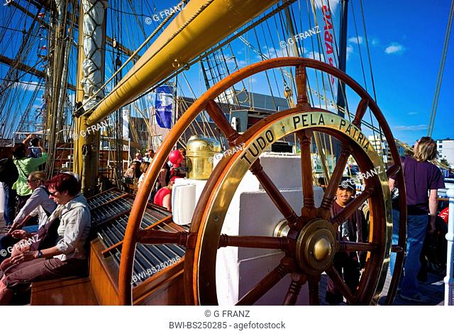 wheel of a training ship 'Cisne Branco' with tourists on board