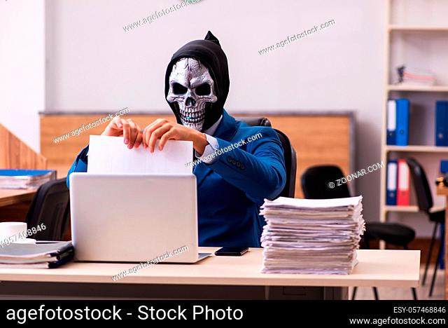 Devil businessman employee working in the office