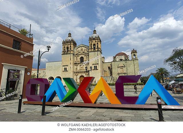 Plaza Santo Domingo with colorful letters OAXACA and the Church of Santo Domingo de Guzman in the background in Oaxaca de Juarez, Mexico