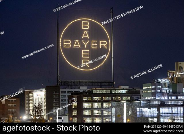 20 November 2023, NoW, Cologne: The Bayer Cross, the company's logo, shines on the Bayer site in Leverkusen. Bayer has discontinued a study with an important...