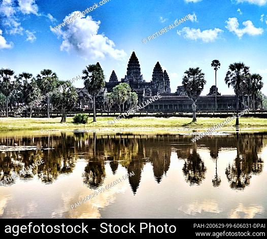 23 October 2019, Cambodia, Siem Reab: The main temple Angkor Wat is reflected in the water. King Suryavarman had the temple, now a national symbol