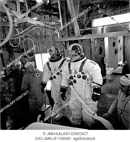 Astronaut William R. Pogue, left, and scientist-astronaut Edward G. Gibson prepare to take part in a high altitude chamber test at the Kennedy Space Center...