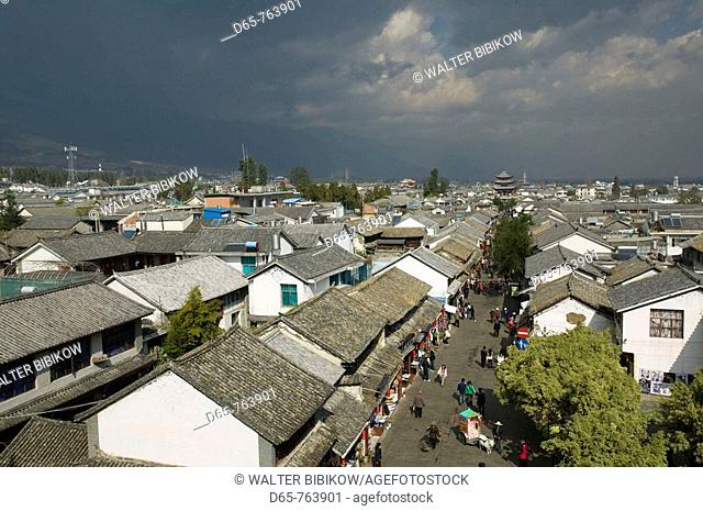 China. Yunnan Province. Dali: Dali Old Town. Pedestrian Zone on Wenxian Lu with Wuhua Building / Morning