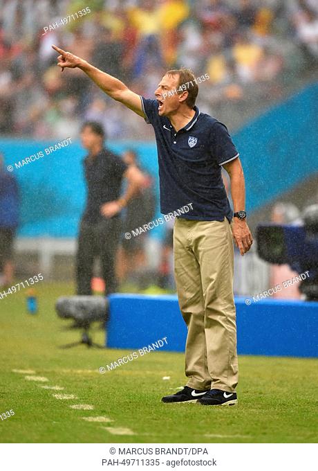 US coach Juergen Klinsmann gestures during the FIFA World Cup group G preliminary round match between the USA and Germany at Arena Pernambuco in Recife, Brazil