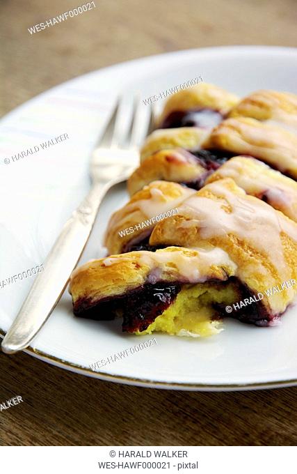 Homemade danish pastry with an elderberry jam and vanilla custard filling