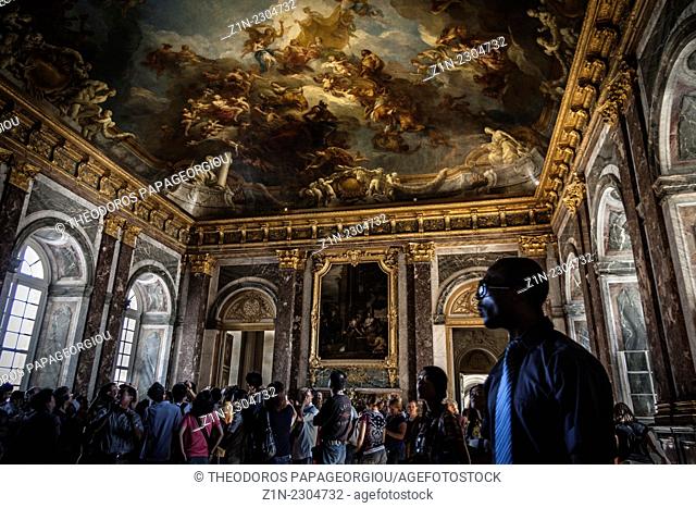 Tourists at Hercules Drawing Room. Palace of Versailles, France