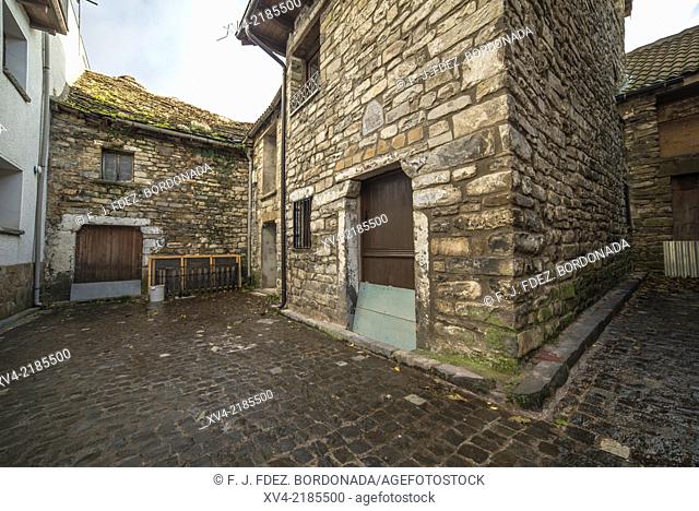 Stone architecture of houses and narrow streets in Aragues del Puerto village, Huesca Pyrenees, Aragón, Spain