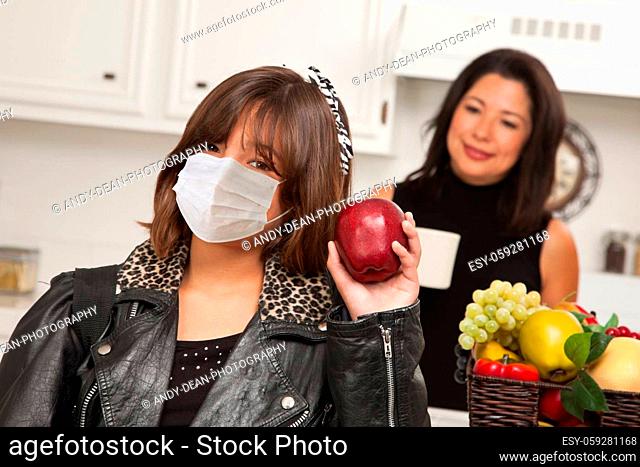 Young Hispanic Girl Student with Mother At Home Getting Ready For School Wearing Medical Face Mask