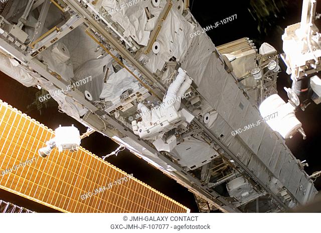 This wide scene of the final STS-115 extravehicular activity has been quite typical this week, as the Atlantis crew members and the International Space Station...