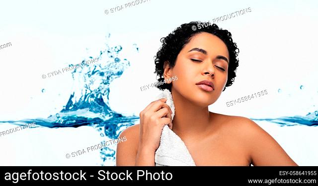 young african american woman with bath towel