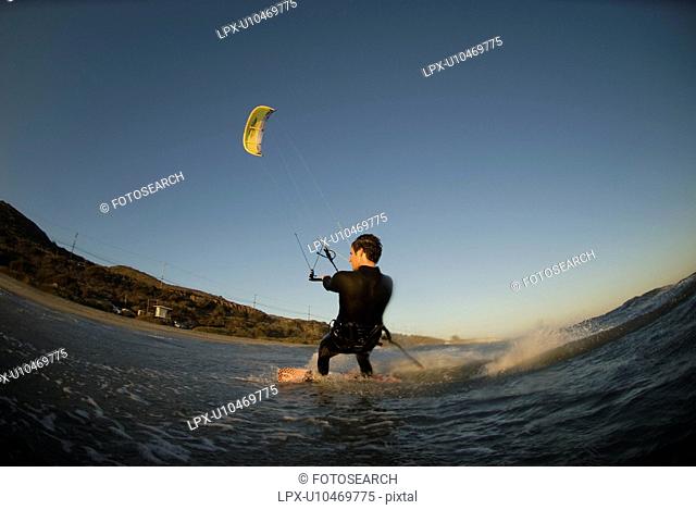 A male kite surfing