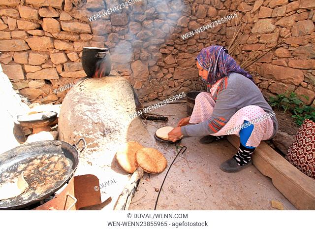 Daily life of Berber villagers in the High Atlas mountains of Morocco Pictured: Berber woman making bread Featuring: Atmosphere Where: High Atlas