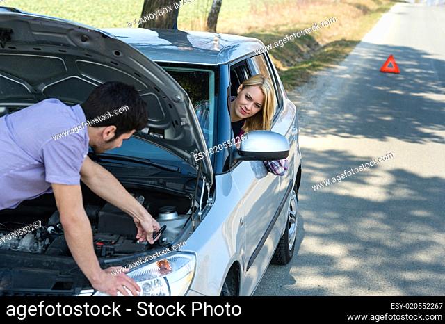 Car troubles couple starting cables vehicle