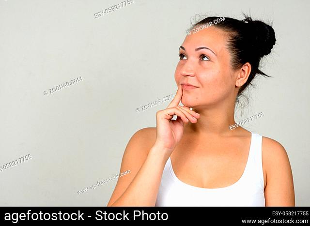 Studio shot of beautiful woman against white background