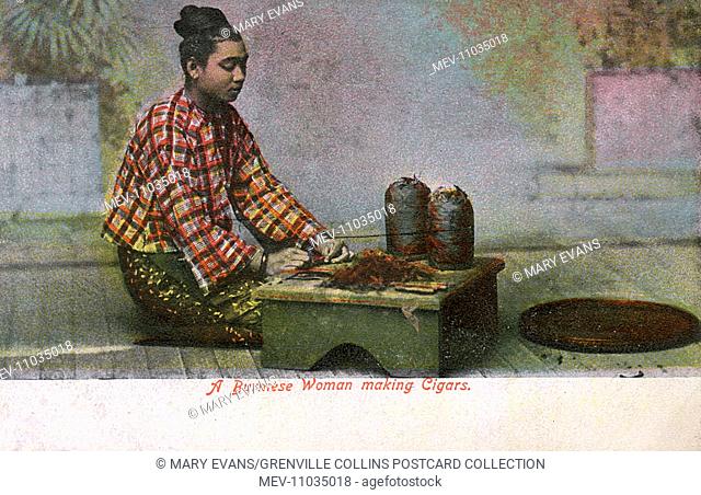Myanmar - Burmese woman rolling leaf tobacco into large cheroot cigars. Cheroots are traditional in Burma and India, consequently