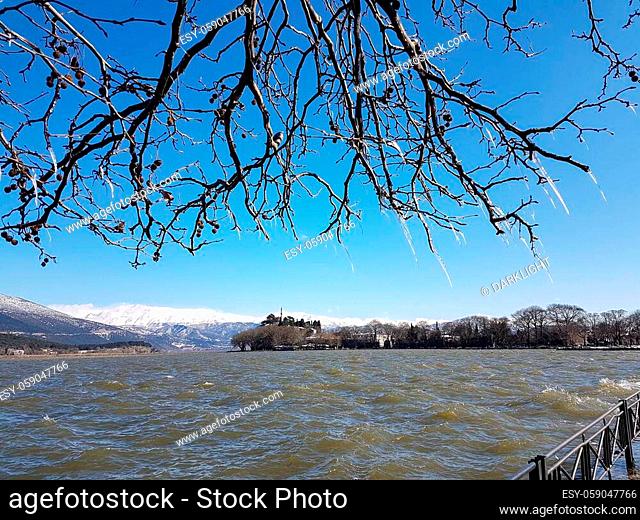 ice stalactites in ioannina city greece wind waves in winter season in front of lake pamvotis greece