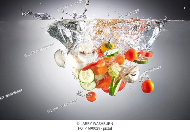 Close-up of chopped vegetables in splashing water