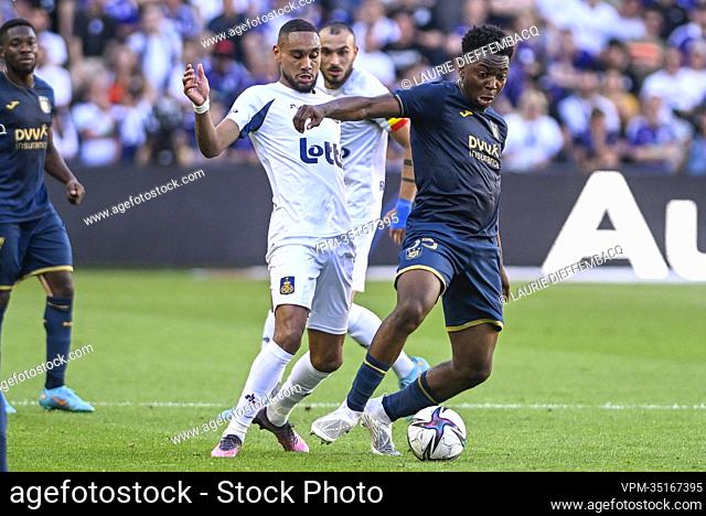 Union's Loic Lapoussin and Anderlecht's Marco Kana fight for the ball during a soccer match between RSC Anderlecht and Royale Union Saint-Gilloise