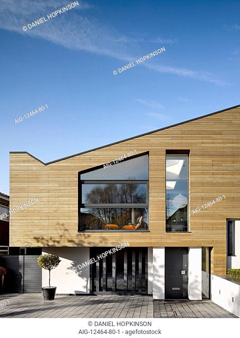 Timber cladding on building exterior of private house in Worsley, Salford, Greater Manchester, England, UK