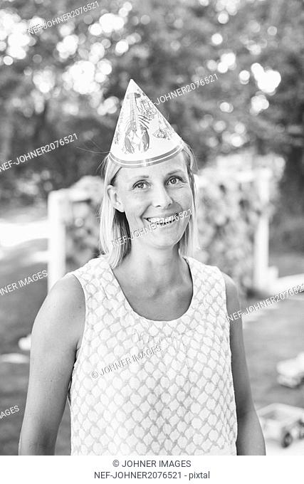 Mature woman in party hat