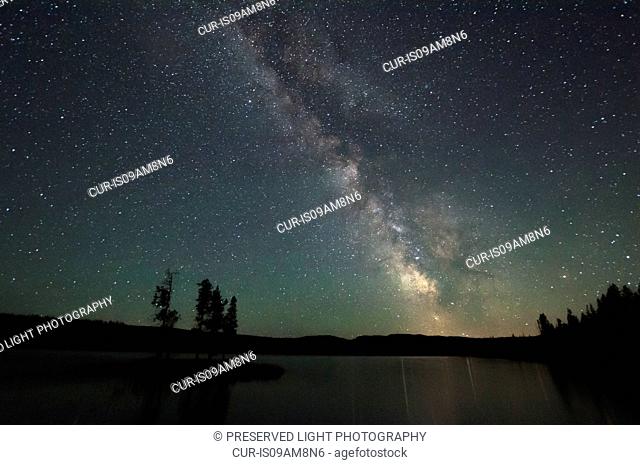 View of lake and stars at night, Thompson Okanagan, Penticton, British Columbia, Canada