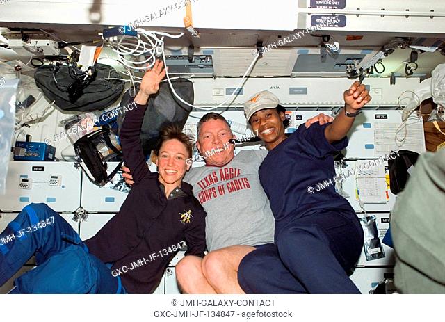 Astronauts Lisa M. Nowak (left), Michael E. Fossum and Stephanie D. Wilson, STS-121 mission specialists, enjoy a light moment on the middeck of the Space...